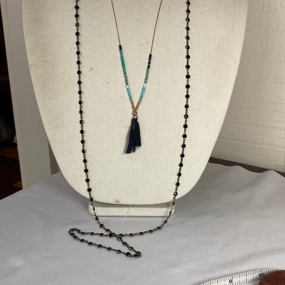 Two long dainty tassel and station bead necklaces